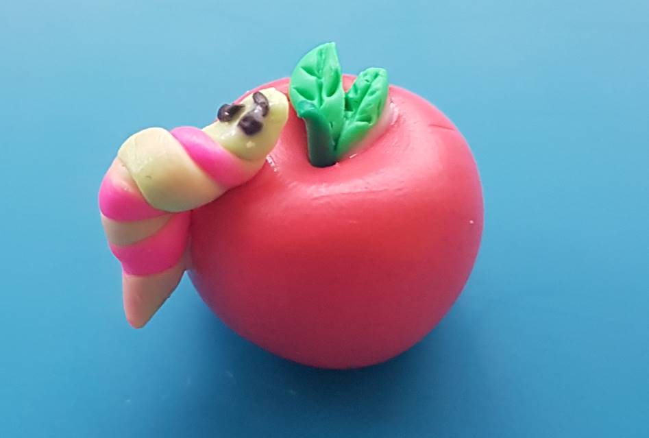 polymer clay apple with caterpillar